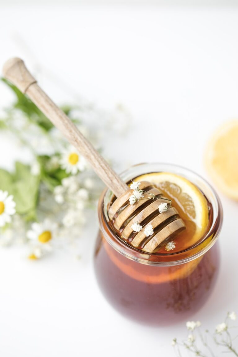 raw local honey in glass on table