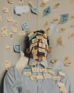 man with stress post its covering him